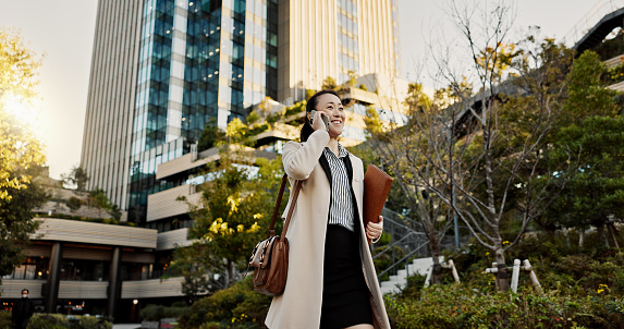 Cit, phone call and woman with business, speaking and walking with network, digital app and communication. Japan, person and worker with a cellphone, connection or smile with contact and professional