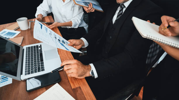 istock Group of business analyst team analyzing financial data report. Habiliment 2032116234