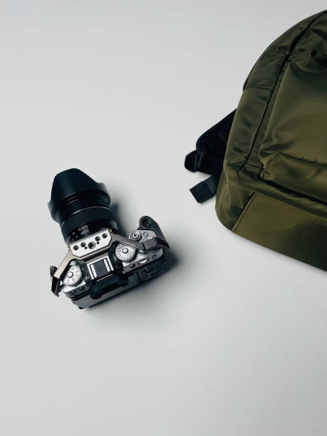 istock Camera and backpack. Travel preparation. Minimalist wallpaper. 2032127238