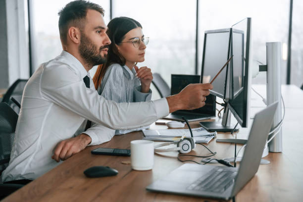 istock Conception of teamwork. Two employees are in the office together 2032129975