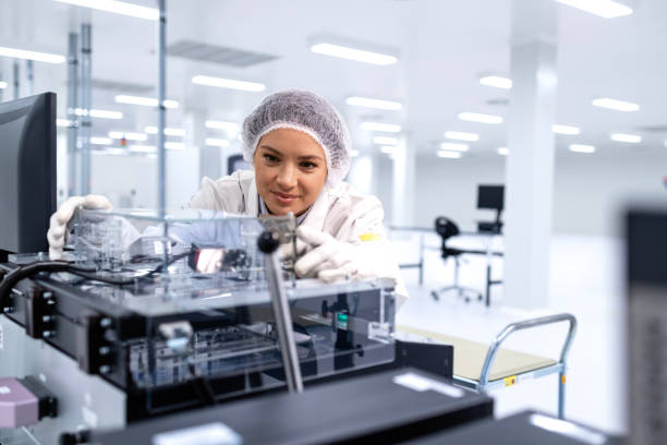 istock Maintenance engineer servicing automated machine in reserch and development factory. 2032152379