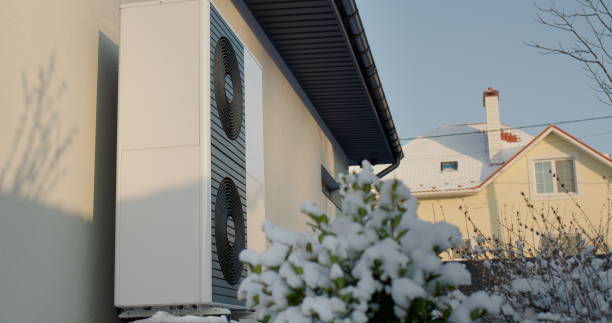 Heat pump near a modern cottage. Modern technologies in heating