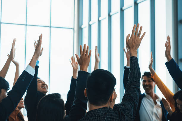istock Successful business people raised their hands up for voting. Intellectual. 2032155587