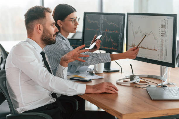 istock Two employees are working in the office together 2032159824