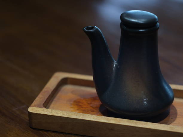 Japanese soy sauce ceramic teapot on wood table.