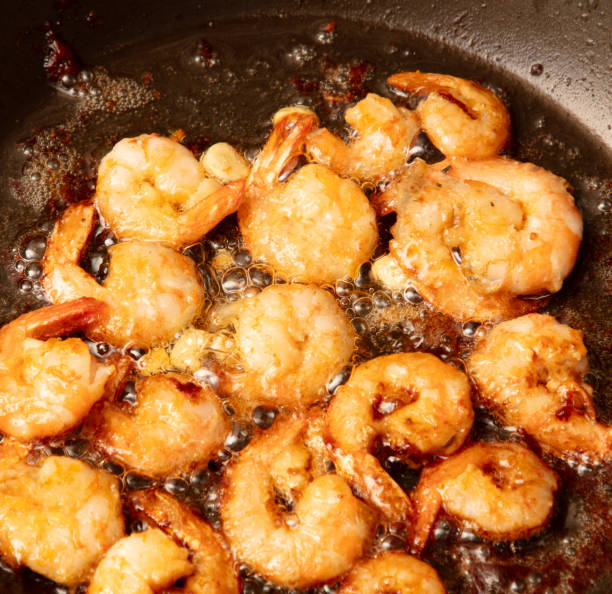 istock Shrimp are fried in a frying pan in oil 2032186169