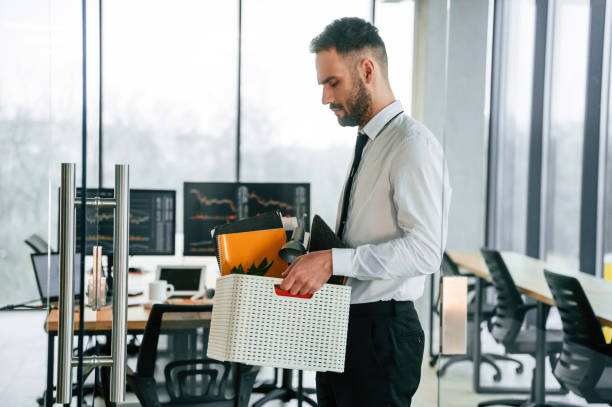 istock Unemployed man is with personal belongings after being fired 2032187757