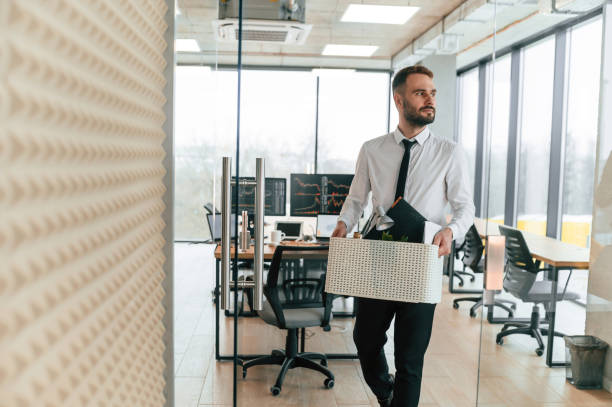 istock Walking forward. Unemployed man is with personal belongings after being fired 2032193216