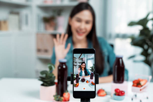 istock Selective focus phone mixed strawberry and cherry juice drinks. Stratagem. 2032195387