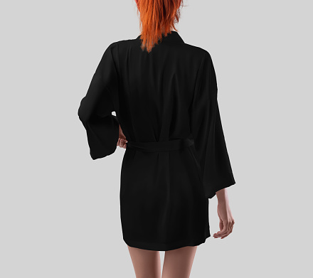 Template of black silk robe on sporty girl with bright hair, back view, kimono with belt, place for design, pattern, branding. Mockup of female home apparel above the knees, isolated on background.