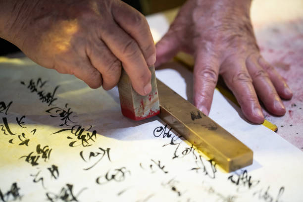 istock Chinese old man writing Chinese calligraphy 2032209481