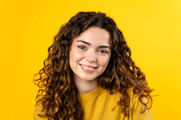 istock Joyful Young Woman on Yellow 2032222469