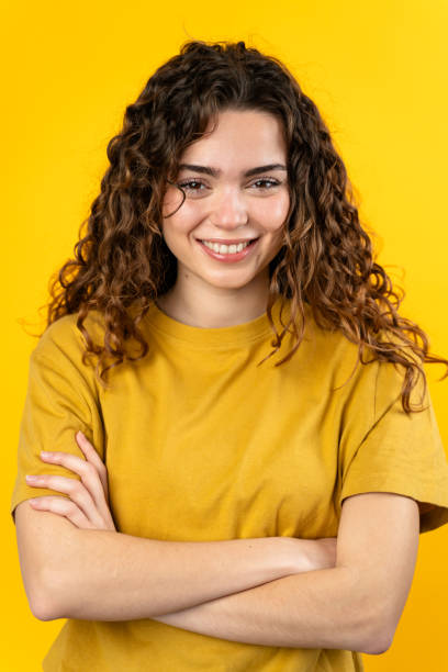 istock Confident Young Woman with Crossed Arms 2032230657