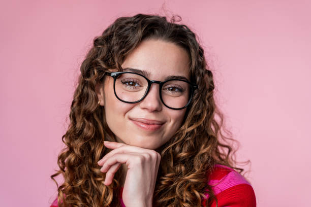 istock Thoughtful Woman with Glasses Posing 2032233335