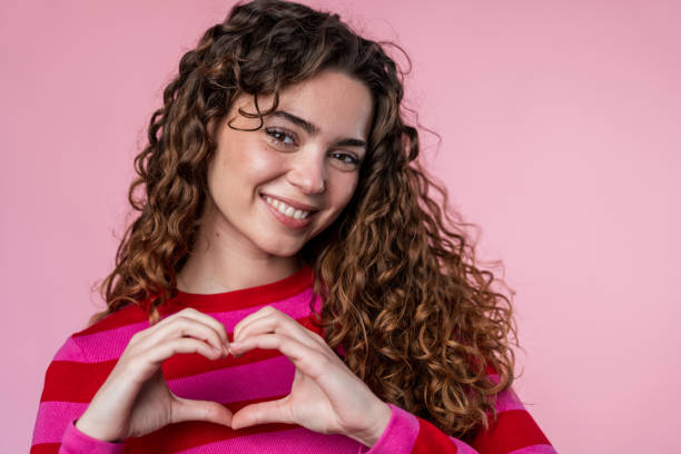 istock Woman Making Heart Gesture 2032235726