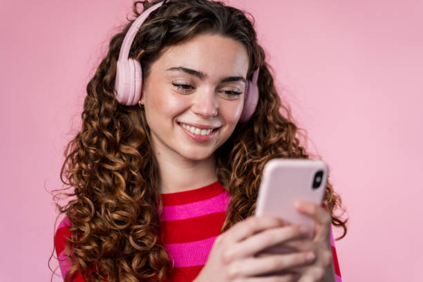 istock Woman Using Smartphone with Headphones 2032238170