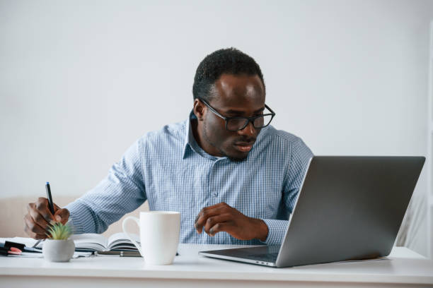 istock Manager is using laptop. Businessman is working in the office 2032239765
