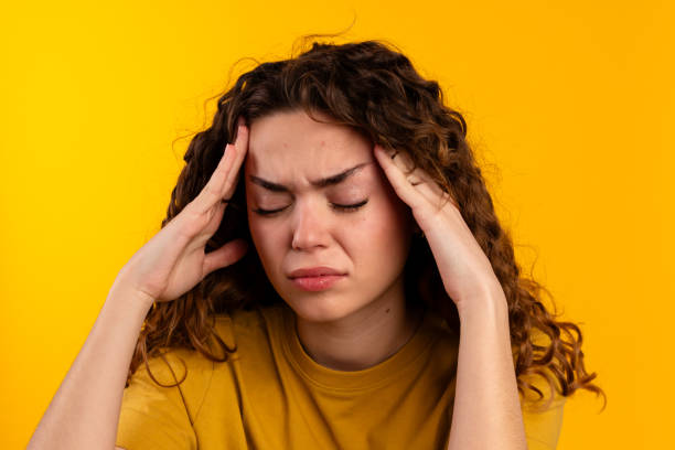 istock Young Woman with a Headache 2032260292