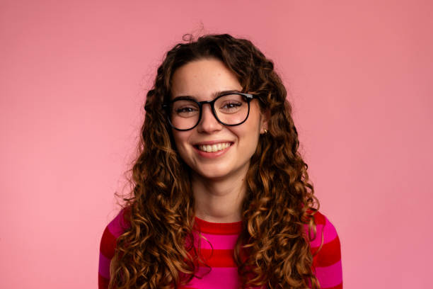 istock Smiling Curly-Haired Woman with Glasses 2032261876