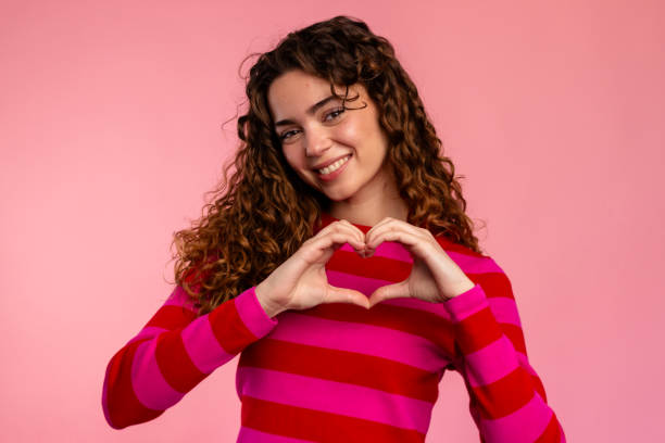 Woman Making Heart Shape with Hands