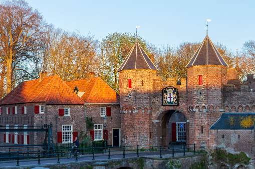 Cozy traditional courtyard in Bruges. Architecture of red brickwall. Medieval St. John's hospital, now Memling museum