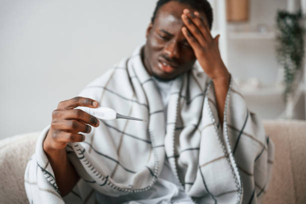 istock Horrible headache. Sick black man is at home 2032275622