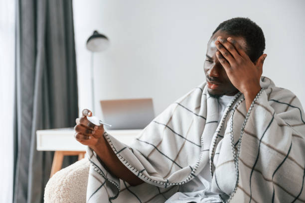istock Horrible headache. Sick black man is at home 2032276043