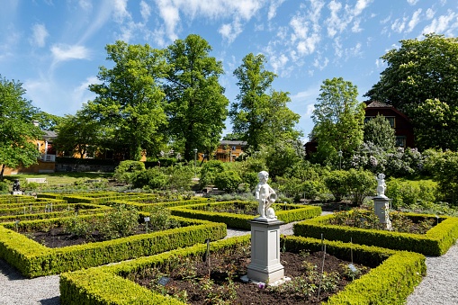 A manicured garden with hedges, pollarded trees and statues is located in this popular Swedish attraction