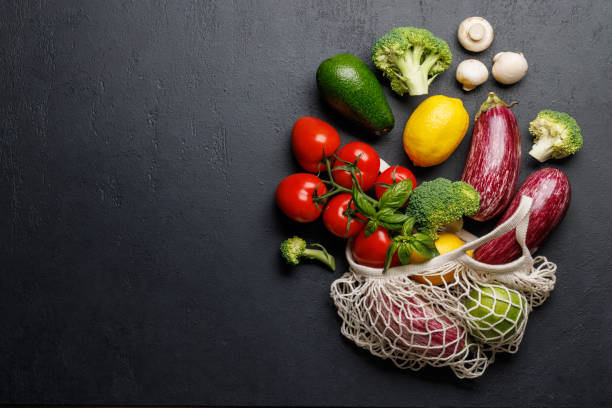 istock Mesh bag filled with a variety of vegetables 2032288435