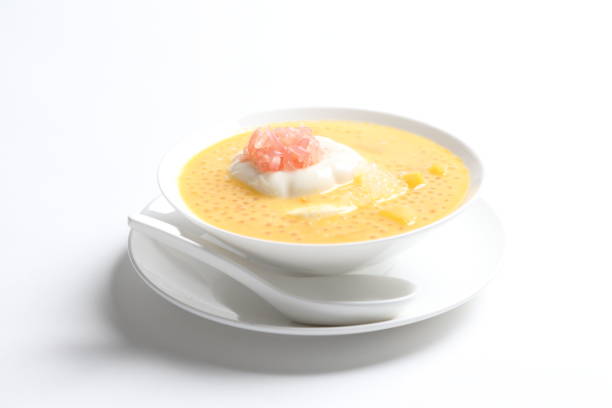 istock chilled mango sago fruit with pink pomelo and soya pudding jelly in white bowl on white background asian cafe sweet dessert halal menu 2032289583