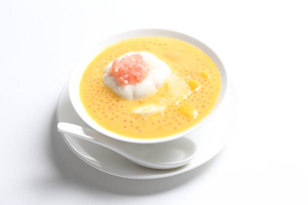 istock chilled mango sago fruit with pink pomelo and soya pudding jelly in white bowl on white background asian cafe sweet dessert halal menu 2032290090