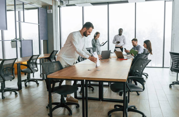 istock Team of office workers are together indoors 2032290130