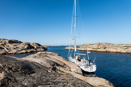 The scenic beauty of the small rocky islands off the coast of the Gothenburg Archipelago in Sweden. The rugged terrain, surrounded by the Nordic waters, showcases the idyllic coastal landscape, inviting travelers to explore the pristine and remote maritime retreat.