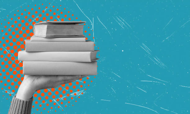 istock Art collage, hand holding a stack of books from the library, store on blue background with space for text. 2032309811