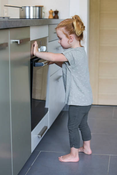 istock Little girl in a kitchen 2032321234
