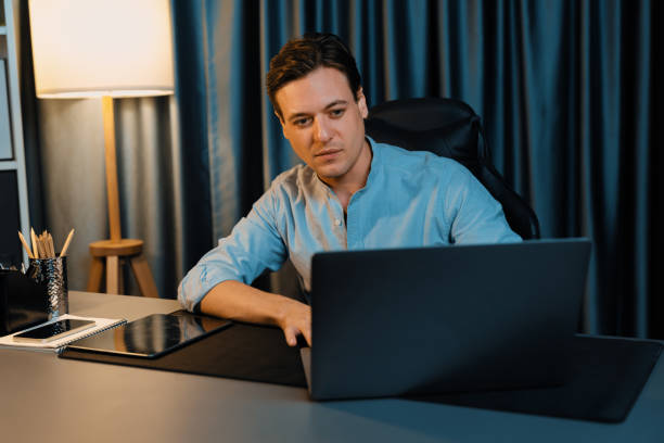 istock Businessman working on laptop for searching database market stock. Pecuniary. 2032329928