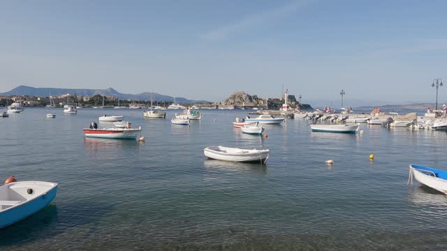 Panoramic view of Corfu island capital town wtih sailing boats of Garitsa bay