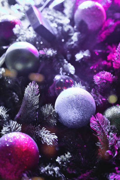 istock Christmas decorations copy space, Christmas Tree Toppers, decorated trees with dazzling light displays, garland ornaments and defocused lights background 2032336470