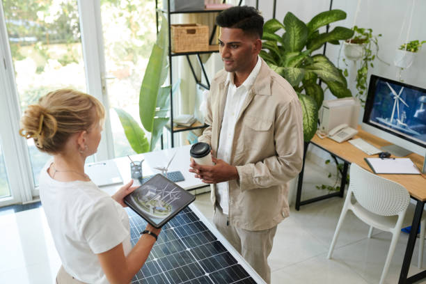 istock Renewable Energy Sales Manager Talking to Client 2032340894