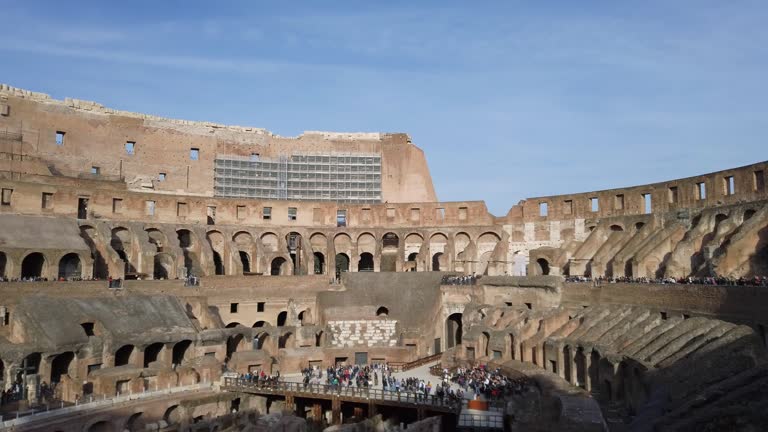 Amazing Hyper time lapse of the Colosseum, one of the seven wonders of the world UNESCO Heritage - view of the Roman monument with tourist sightseeing the attraction