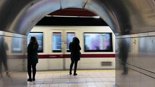 Motion blur of metro underground public train departing at station track in Rome, Italy