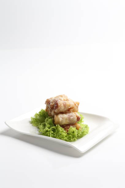 istock crispy deep fried bacon roll meat sausage with mayonnaise in plate on white background design dim sum appetiser food snack halal menu for Hong Kong cafe 2032383350