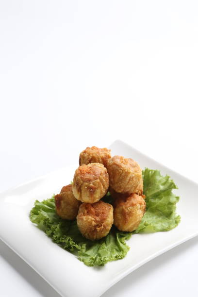 istock deep fried pork chicken siew mai meat ball dim sum in plate on white background appetiser food snack halal menu for Hong Kong cafe 2032384398