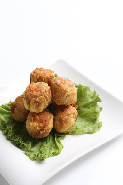 istock deep fried pork chicken siew mai meat ball dim sum in plate on white background appetiser food snack halal menu for Hong Kong cafe 2032384403