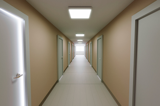 A long corridor with offices in an industrial building.