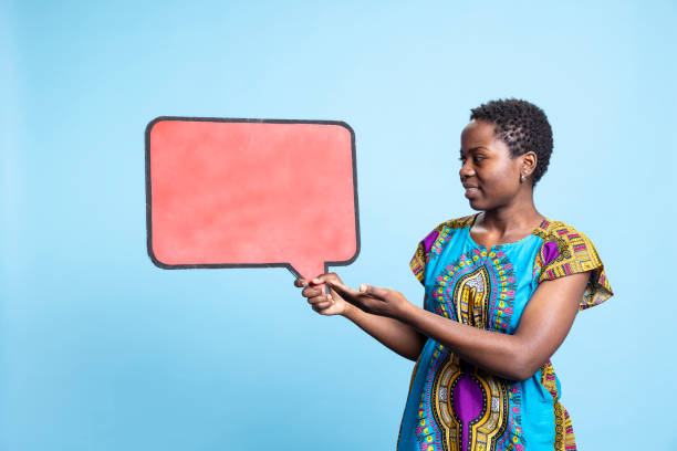 Stylish woman holding speech bubble sign to create an advertisement