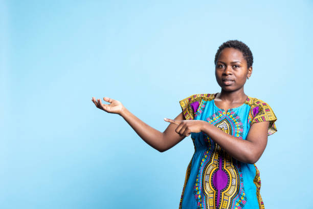 istock Confident woman in traditional ethnic costume creates advertisement 2032421372