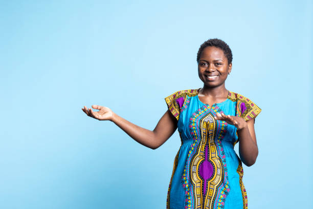 istock Charming person wears in ethnic attire and shows something in studio 2032421387