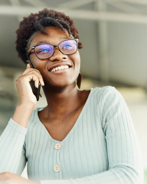 istock Happy black woman talking on mobile phone. 2032421929