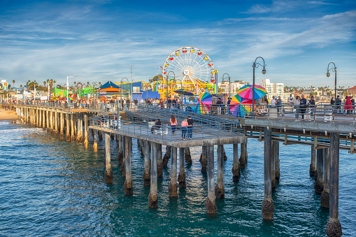 The Santa Monica Pier is a large pier at the foot of Colorado Avenue in Santa Monica, California, United States. It contains a small amusement park, concession stands, and areas for views and fishing.